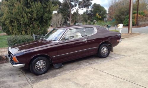 Datsun 180B SSS Bluebird 610 Hardtop maroon burgundy paint.jpg