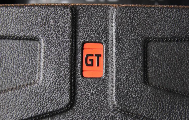 242 GT steering wheel red badge image.png