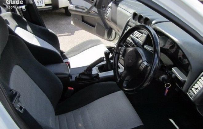 4 door R34 GT-T white Front seats and steering wheel.jpg