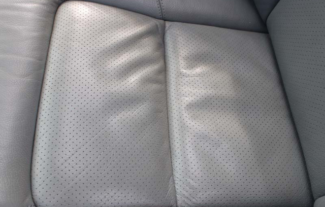 C140 Mercedes coupe early perforated leather seat trim image close up.png