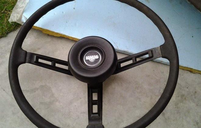 Datsun 180B 610 coupe SSS badge steering wheel round boss.jpg