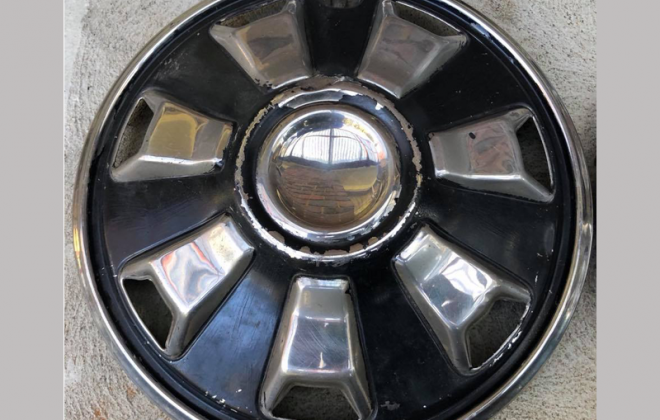 Datsun 180B SSS 7-slot stainless steel hubcap image.png