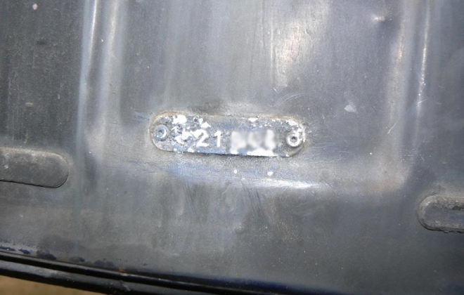 E-Type Jaguar Rear licence plate body number tag location.png