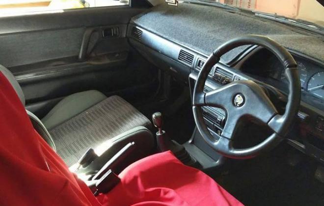 Mazda Familia GTX front interior steering wheel.jpg