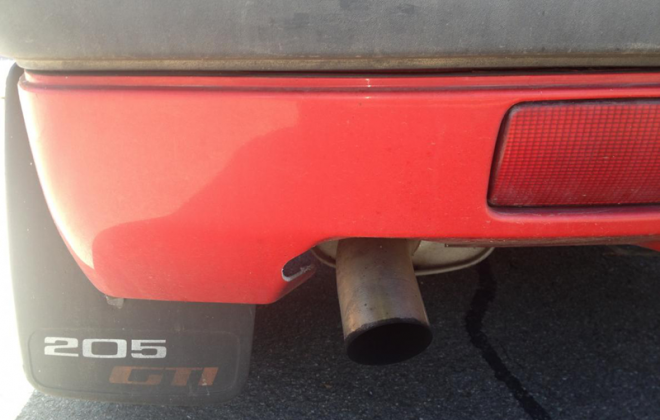 Stock exhaust and optional 205 GTI mudflaps.png