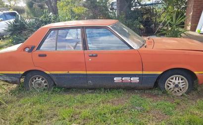 1981 Datsun Stanza SSS sedan red on black 2021 parts car wreck (1).jpg