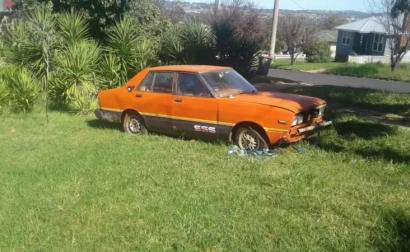 1982 Datsun Stanza SSS sedan red unrestored rusty NSW 2021 (1).png